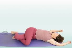 Supta matsyendrasana with eagle legs
