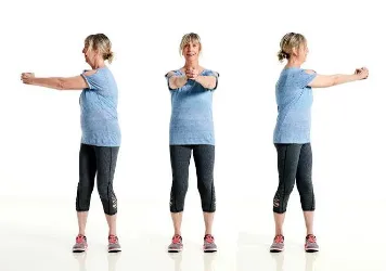 Standing trunk rotation with extended arms